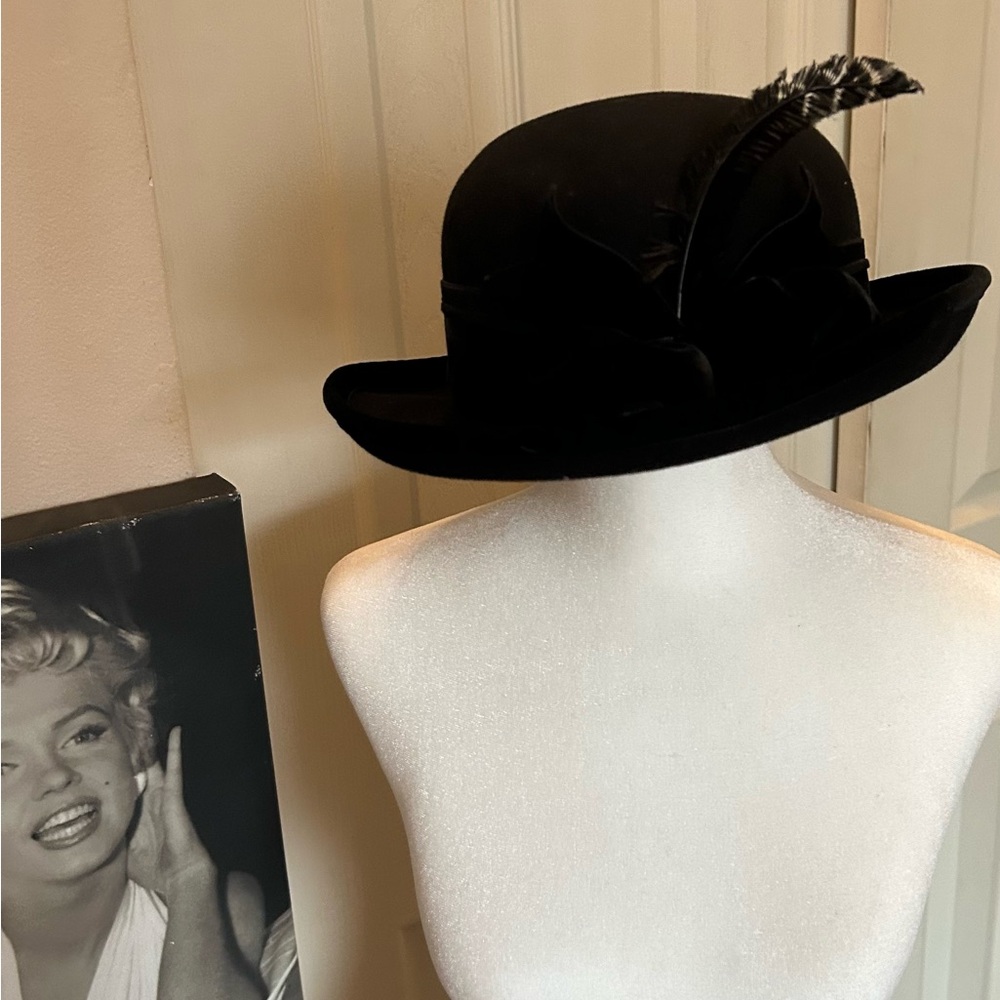 Vintage black wool hat is styled similarly to a bowler or derby hat. S
